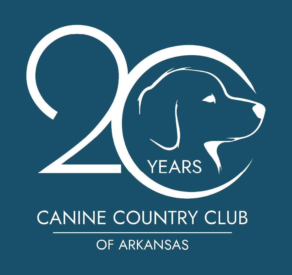 Logo for Canine Country Club of Arkansas featuring 20 Years with a dog’s head inside the zero, white text and design on a dark blue background.